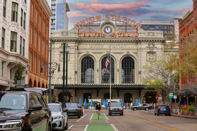 Cyclist riding past Denver's historic Union Station