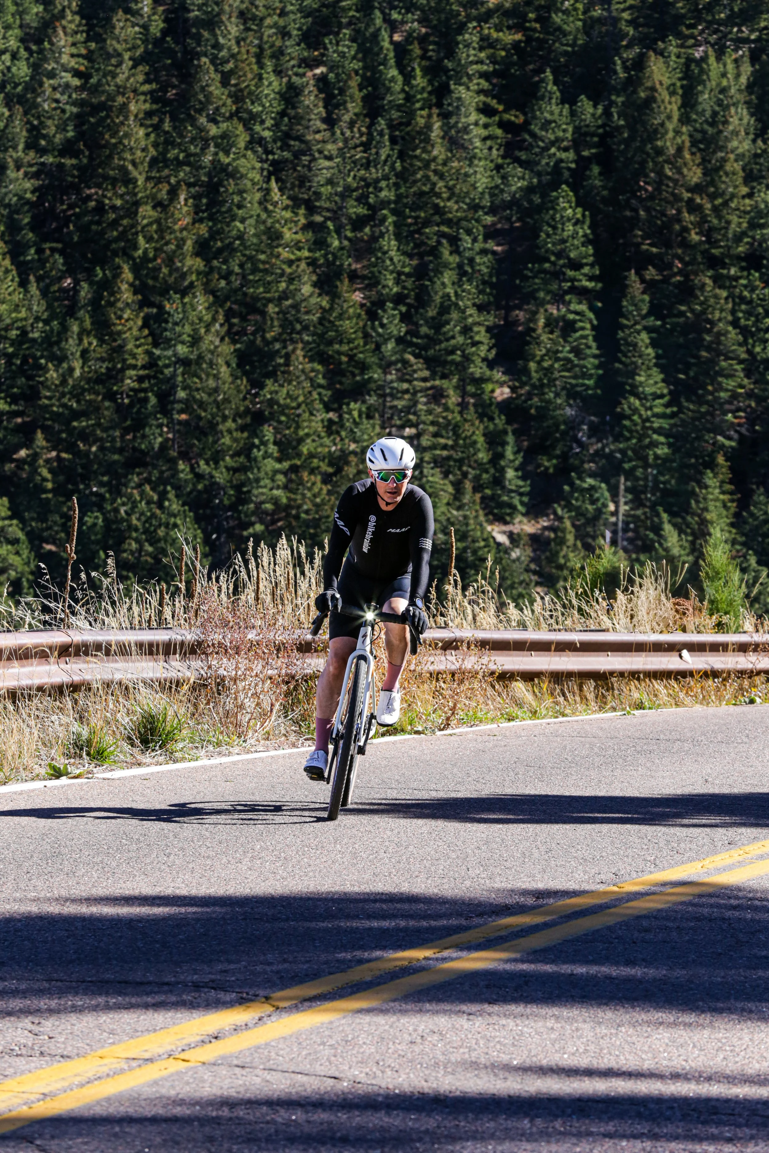 Cyclist riding in a designated bike lane in Denver