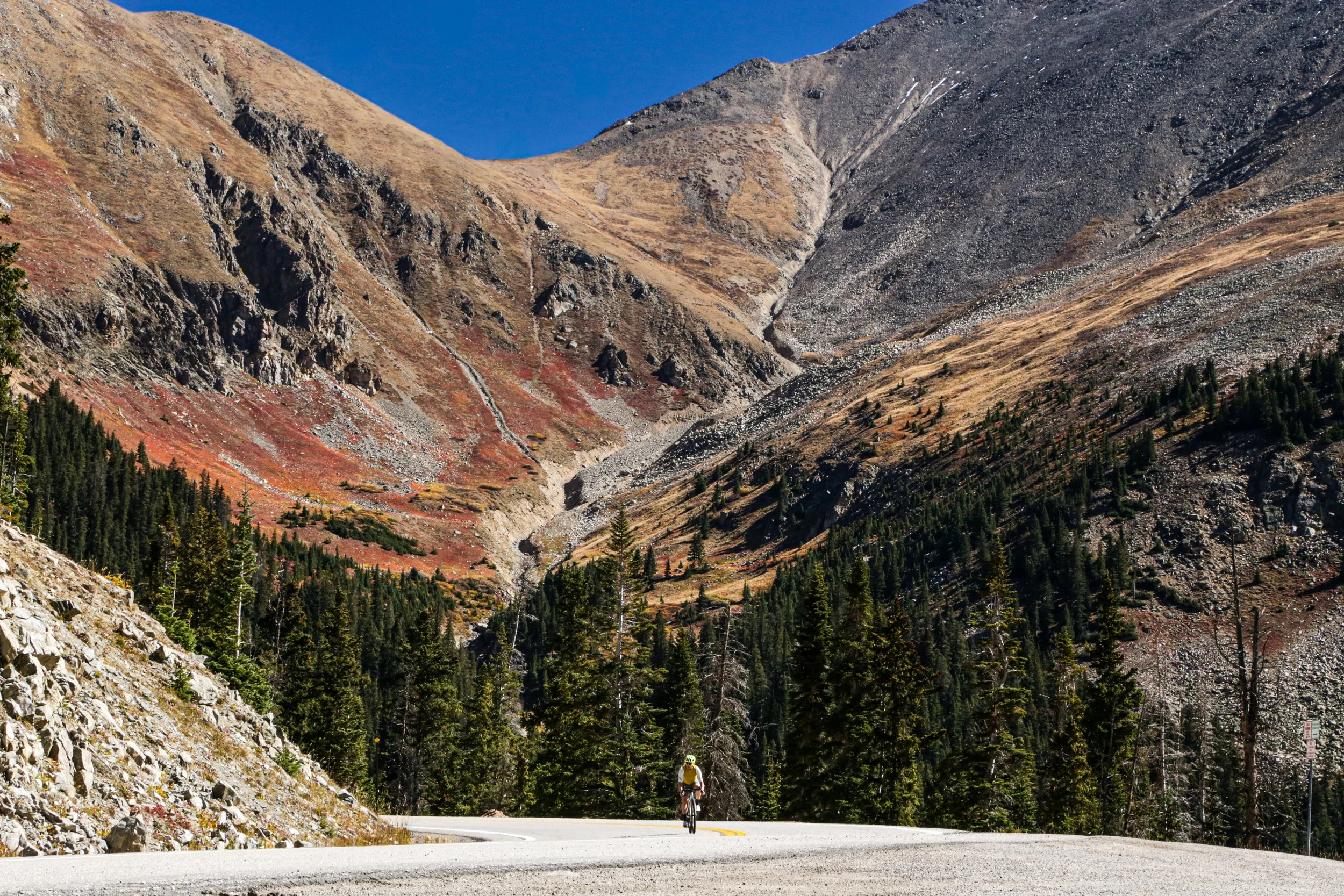 Cyclist riding through a Colorado canyon